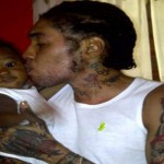 Photo of Vybz Kartel Kissing his kid