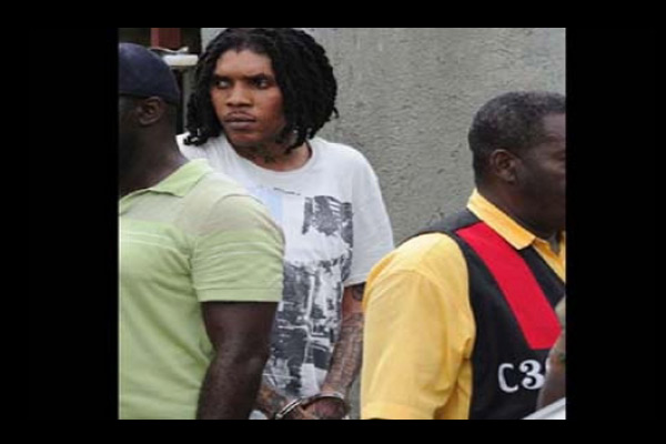 Photo of Vybz Kartel Handcuffed and brought to jail sept 2011