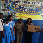 vybz kartel clothing line donates computer to portmore school